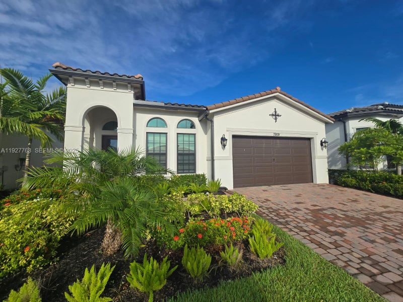 Front exterior of a new home in , Parkland, FL, highlighting curb appeal (Image 30). Front exterior of a new home in , Parkland, FL, highlighting curb appeal (Image 30).