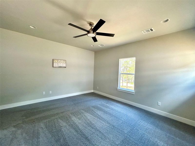 Primary bedroom with ceiling fan with remote control. Primary bedroom with ceiling fan with remote control.