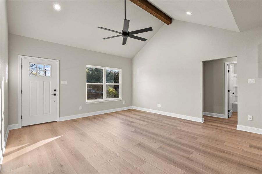 Entrance foyer with beam ceiling, light wood finished floors, plenty of natural light, high vaulted ceiling, and recessed lighting Entrance foyer with beam ceiling, light wood finished floors, plenty of natural light, high vaulted ceiling, and recessed lighting