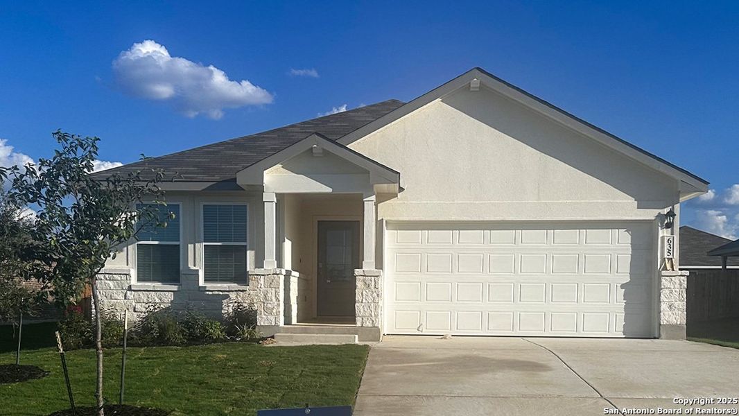 Front exterior of a new home in Steele Creek, Cibolo, TX, highlighting curb appeal (Image 14). Front exterior of a new home in Steele Creek, Cibolo, TX, highlighting curb appeal (Image 14).