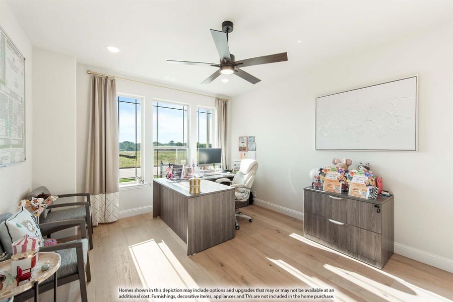 Home office with wood desk, ceiling fan, hardwood floors, and large windows with natural light Home office with wood desk, ceiling fan, hardwood floors, and large windows with natural light