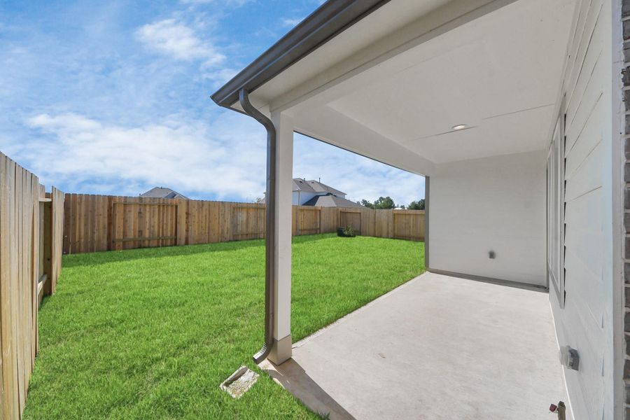 Come and see this spacious backyard with its beautiful covered patio. There is plenty of room for the kids to play and adults to relax. Perfect for your outdoor living space, patio furniture, bbq pit, and so much more. The possibilities are endless! Sample photo of completed home with similar floor plan. Actual colors and selections may vary. Come and see this spacious backyard with its beautiful covered patio. There is plenty of room for the kids to play and adults to relax. Perfect for your outdoor living space, patio furniture, bbq pit, and so much more. The possibilities are endless! Sample photo of completed home with similar floor plan. Actual colors and selections may vary.