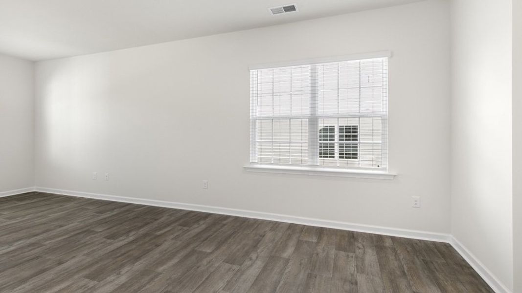 Spacious, unfurnished interior of a new home in The Townes at Galvins Ridge, Sanford (Image 16).
