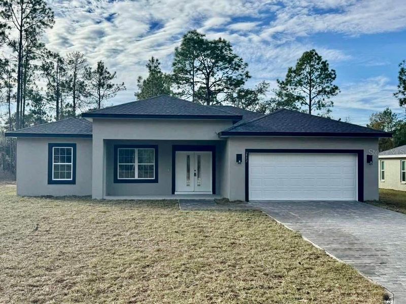 Front exterior of a new home in , Dunnellon, FL, highlighting curb appeal (Image 1). Front exterior of a new home in , Dunnellon, FL, highlighting curb appeal (Image 1).