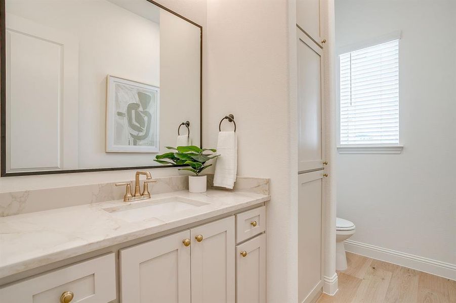 Powder bath with built-in cabinetry. Powder bath with built-in cabinetry.