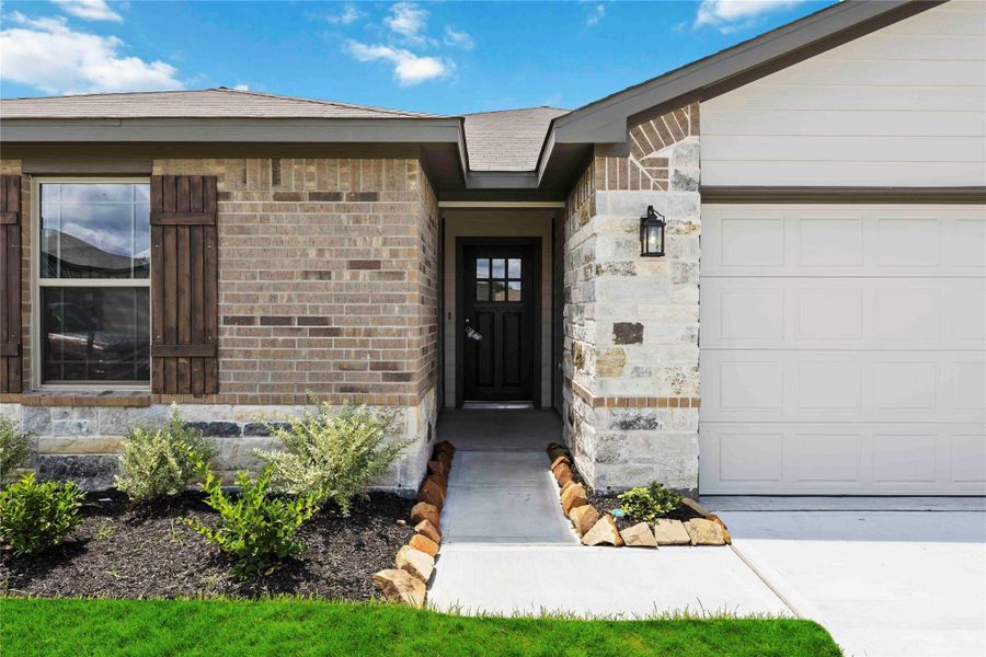 Front exterior of a new home in The Villages at Westpointe, Dayton, TX, highlighting curb appeal (Image 10). Front exterior of a new home in The Villages at Westpointe, Dayton, TX, highlighting curb appeal (Image 10).