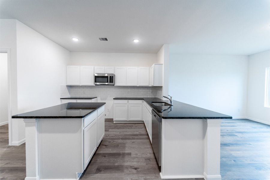 Furnished interior view inside a new home in Sweetgrass Village, Crosby (Image 4).
