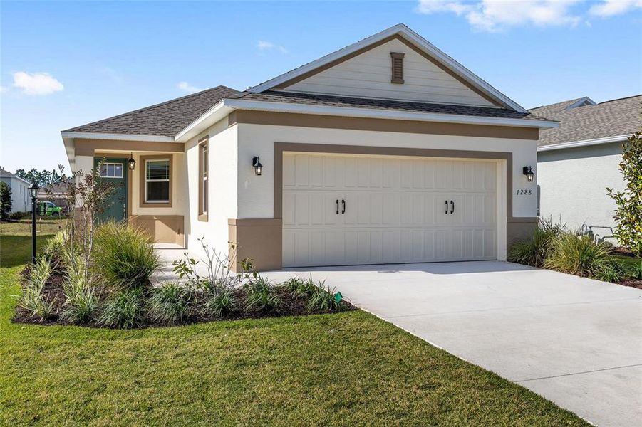 Front exterior of a new home in , Ocala, FL, highlighting curb appeal (Image 17).