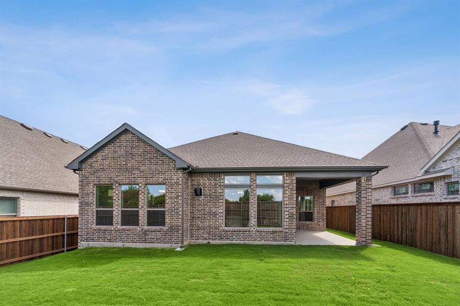 Front exterior of a new home in South Pointe  Cottage Series, Mansfield, TX, highlighting curb appeal (Image 1).