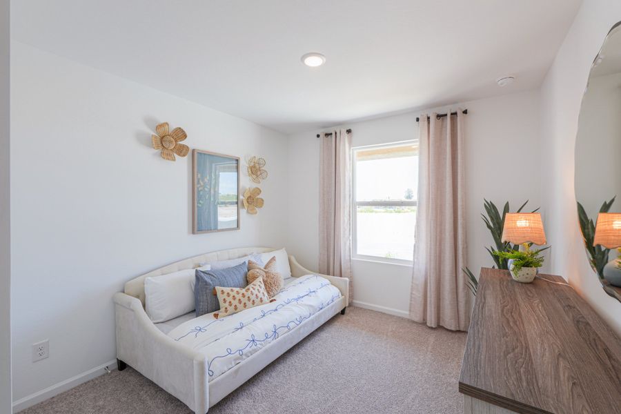 A living room with a white couch. A living room with a white couch.