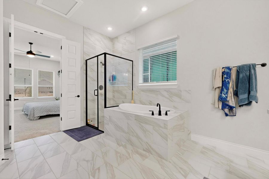 Full bath with a marble finish shower, ensuite bathroom, a garden tub, recessed lighting, and a ceiling fan