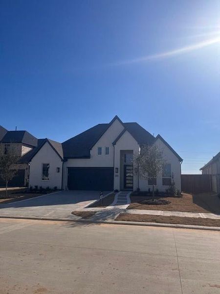 Front exterior of a new home in Elyson, Katy, TX, highlighting curb appeal (Image 1). Front exterior of a new home in Elyson, Katy, TX, highlighting curb appeal (Image 1).