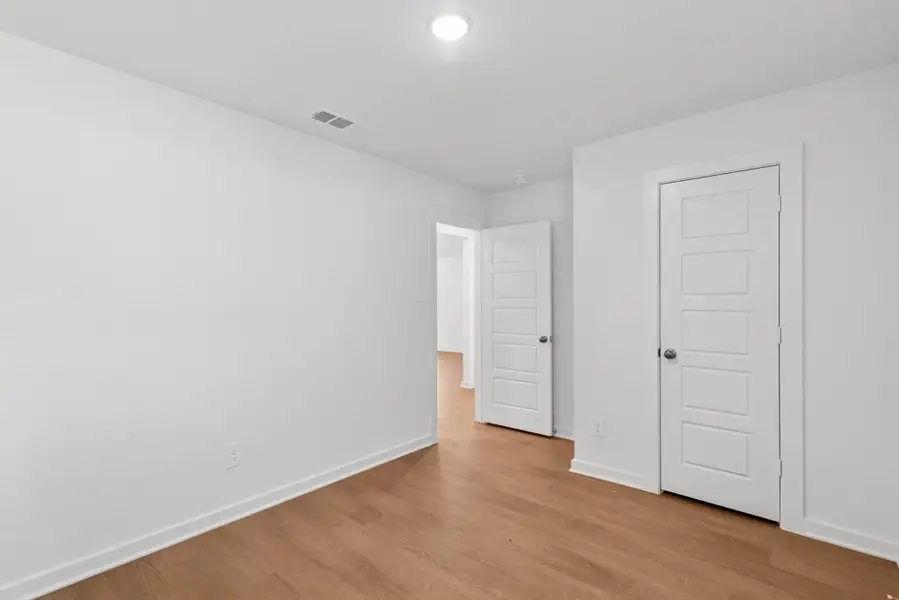 Spacious, unfurnished interior of a new home in Pinewood at Grand Texas, New Caney (Image 11).