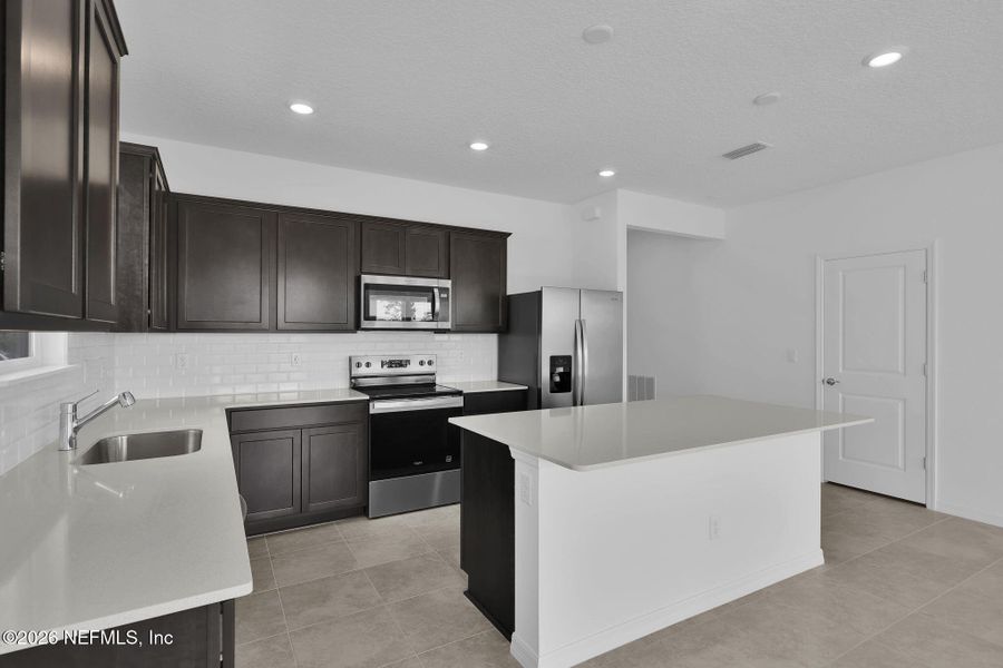 Furnished interior view inside a new home in Hyland Trail, Green Cove Springs (Image 5).