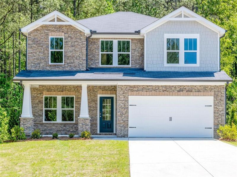Front exterior of a new home in Preserve at Mountain Creek, Pendergrass, GA, highlighting curb appeal (Image 1). Front exterior of a new home in Preserve at Mountain Creek, Pendergrass, GA, highlighting curb appeal (Image 1).