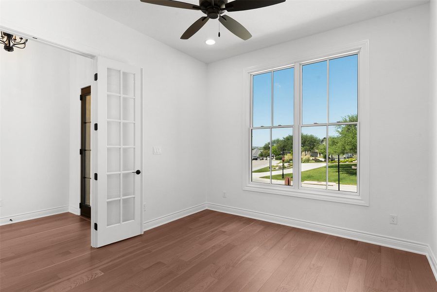 A versatile room with ample natural light, ideal for a home office or creative studio.
