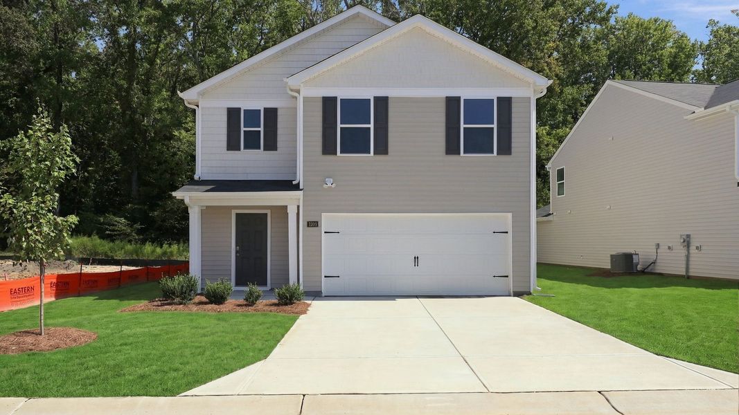 Front exterior of a new home in Carter Ridge, Greenville, NC, highlighting curb appeal (Image 1). Front exterior of a new home in Carter Ridge, Greenville, NC, highlighting curb appeal (Image 1).