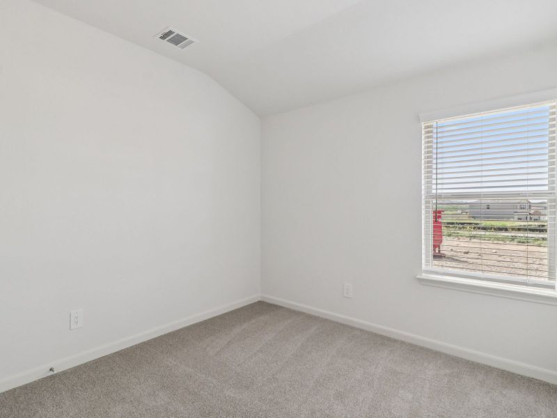 Guest bedroom in the Callaghan floorplan at a Meritage Homes community. Guest bedroom in the Callaghan floorplan at a Meritage Homes community.