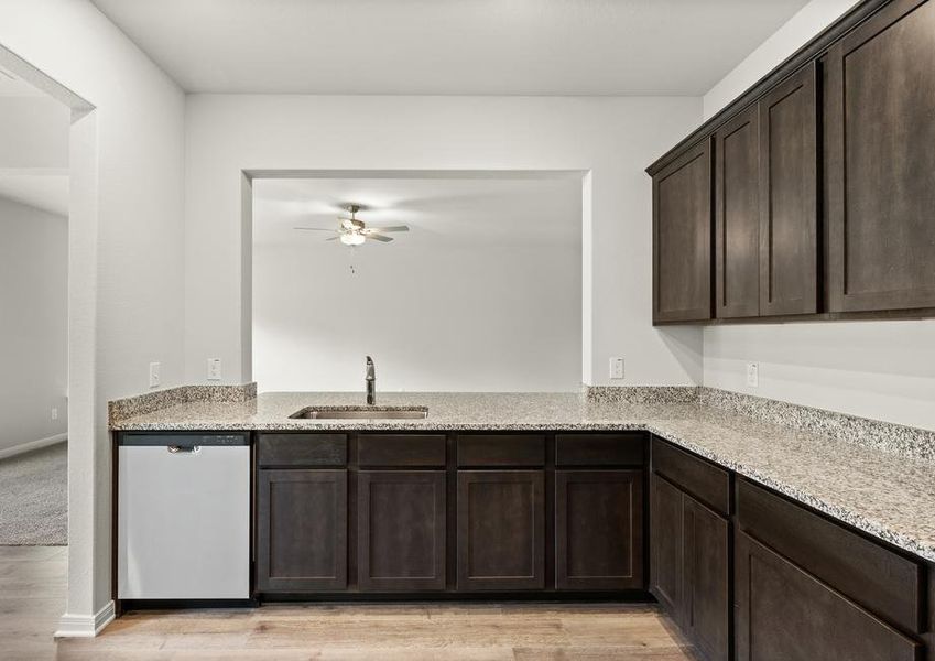 The kitchen of the Rayburn looks out into the family room.