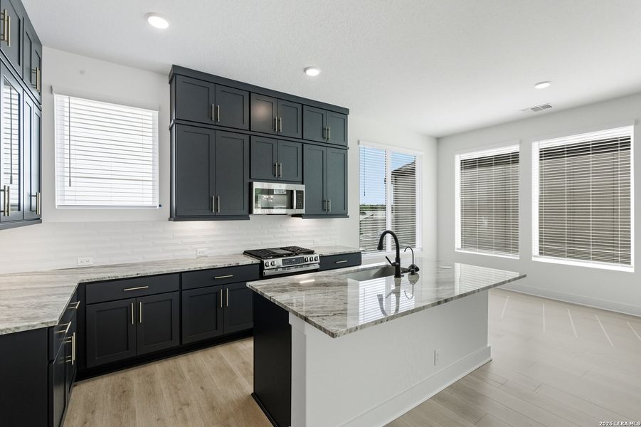 Furnished interior view inside a new home in Centero at Stone Oak, San Antonio (Image 12).