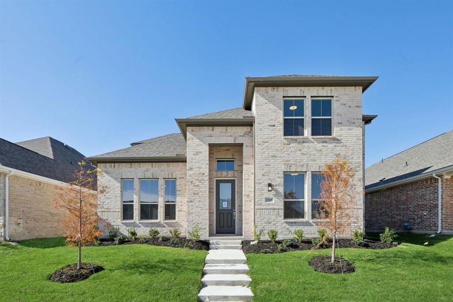 View of front of home featuring a front lawn