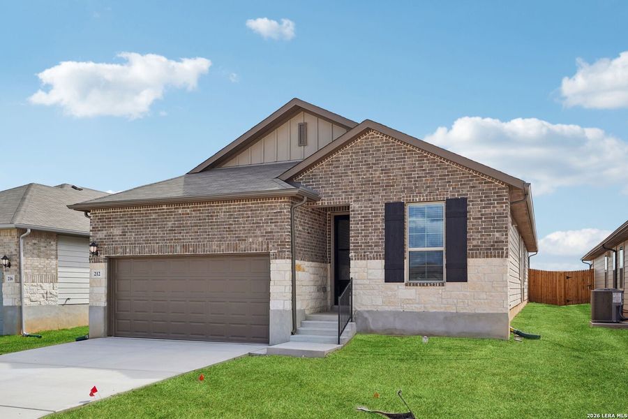 Front exterior of a new home in Legendary Trails - Premier Series, Cibolo, TX, highlighting curb appeal (Image 2). Front exterior of a new home in Legendary Trails - Premier Series, Cibolo, TX, highlighting curb appeal (Image 2).