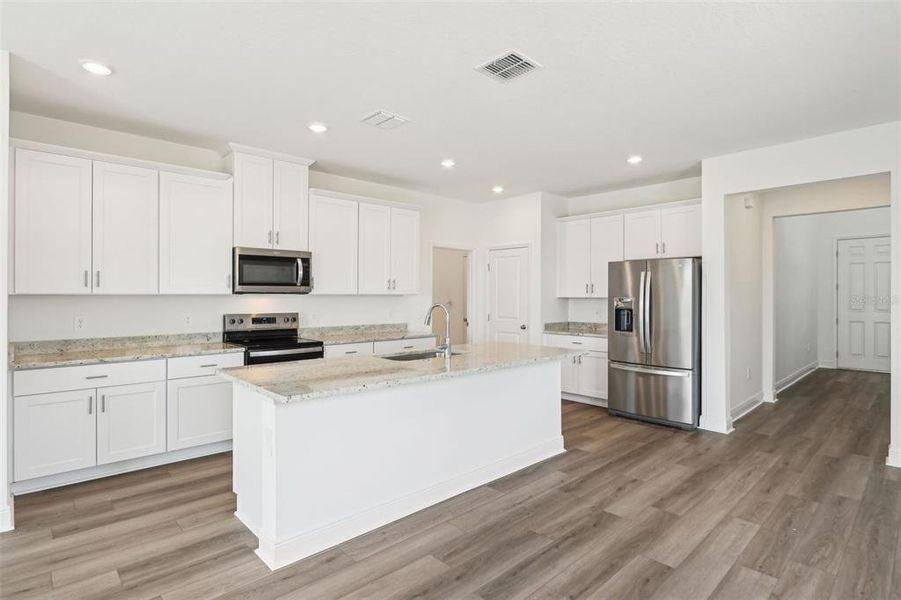 Furnished interior view inside a new home in Cyrene at Minneola - Villas, Minneola (Image 11).