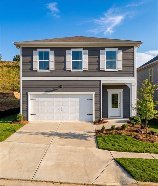 Front exterior of a new home in The Bluffs, Canton, GA, highlighting curb appeal (Image 1). Front exterior of a new home in The Bluffs, Canton, GA, highlighting curb appeal (Image 1).