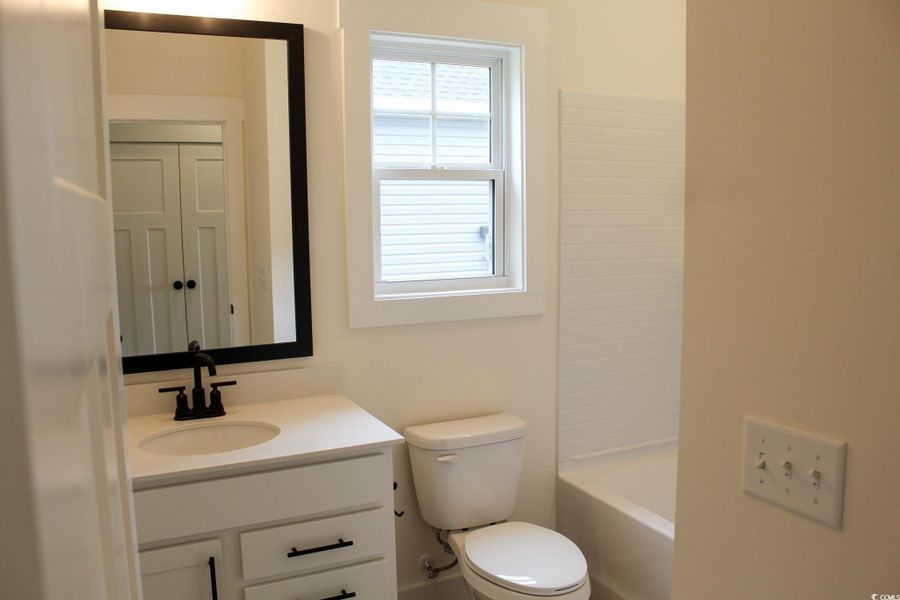 Full bathroom with vanity and bathtub / shower combination