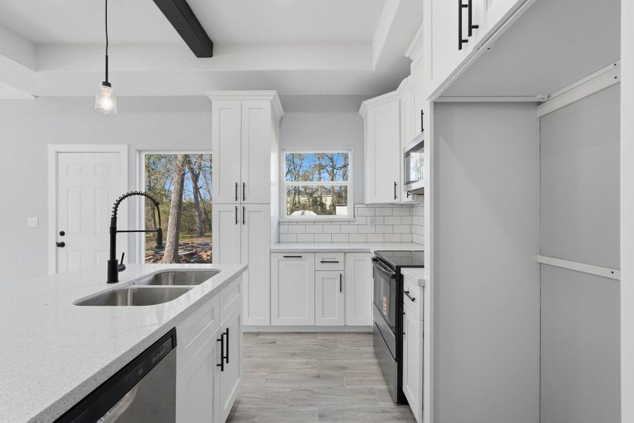 Furnished interior view inside a new home in , Willis (Image 8).