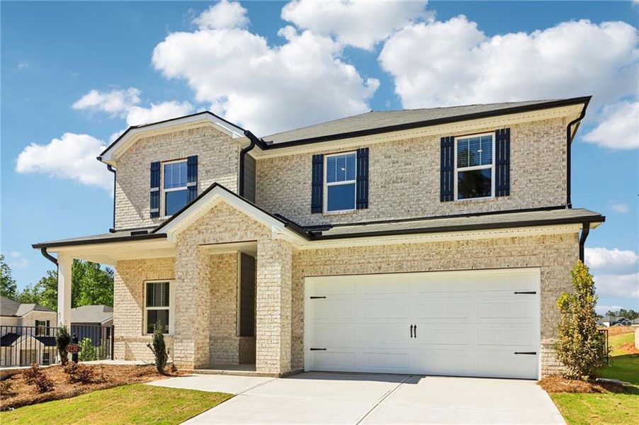 Front exterior of a new home in Harmony Manor, Fairburn, GA, highlighting curb appeal (Image 1). Front exterior of a new home in Harmony Manor, Fairburn, GA, highlighting curb appeal (Image 1).