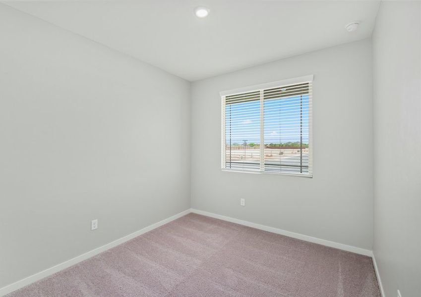 Secondary bedrooms are filled with natural light.