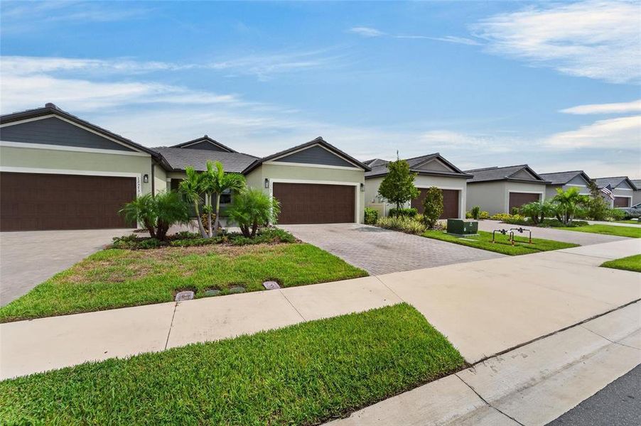 Front exterior of a new home in , Parrish, FL, highlighting curb appeal (Image 33).