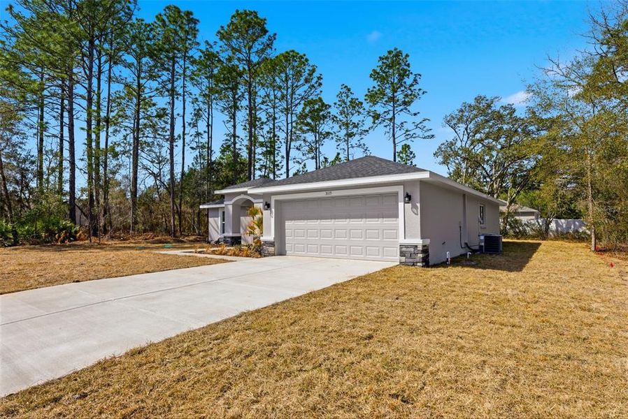 Front exterior of a new home in , Citrus Springs, FL, highlighting curb appeal (Image 31). Front exterior of a new home in , Citrus Springs, FL, highlighting curb appeal (Image 31).