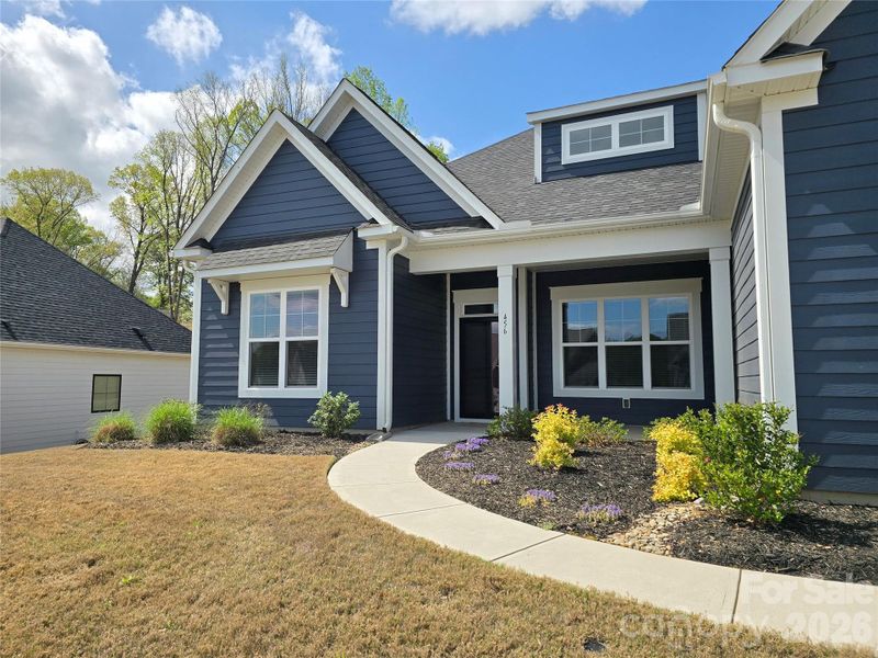 Front exterior of a new home in Red Hill, Concord, NC, highlighting curb appeal (Image 18). Front exterior of a new home in Red Hill, Concord, NC, highlighting curb appeal (Image 18).