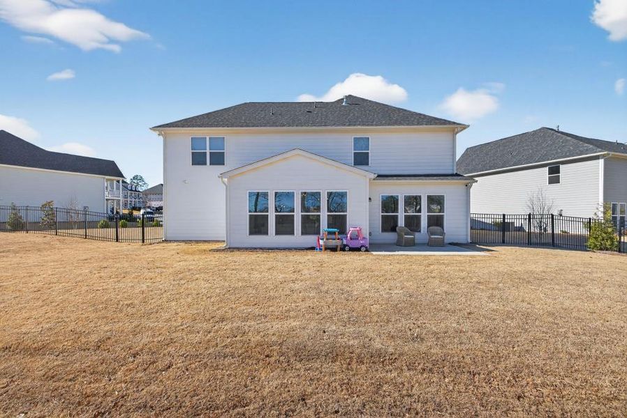 Exterior details and patio area of a home in Reunion, Flowery Branch (Image 32).