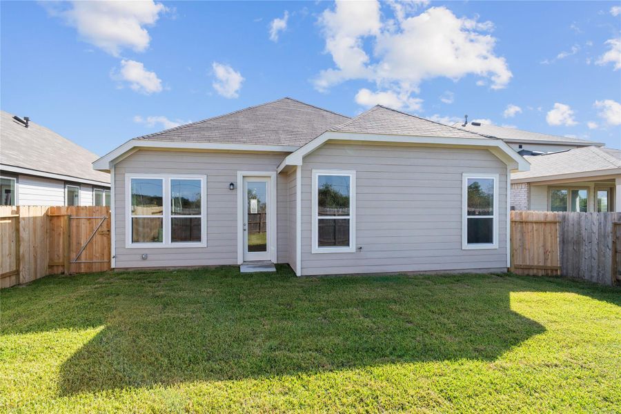 Come explore the backyard—perfect for outdoor living! There's ample space for kids to play and adults to unwind. The possibilities are endless!