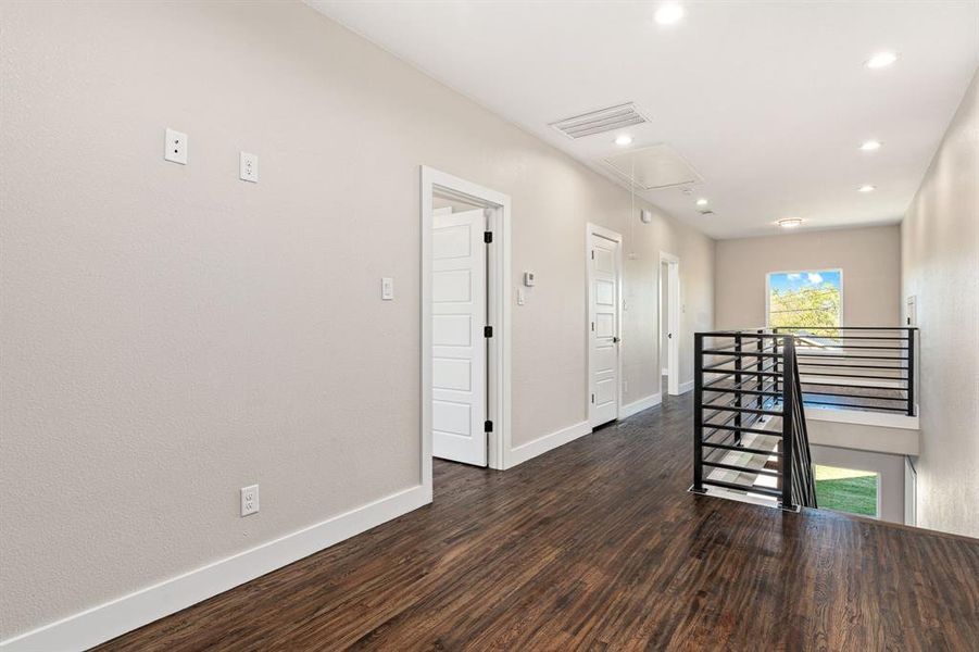 Hallway featuring dark hardwood / wood-style floors