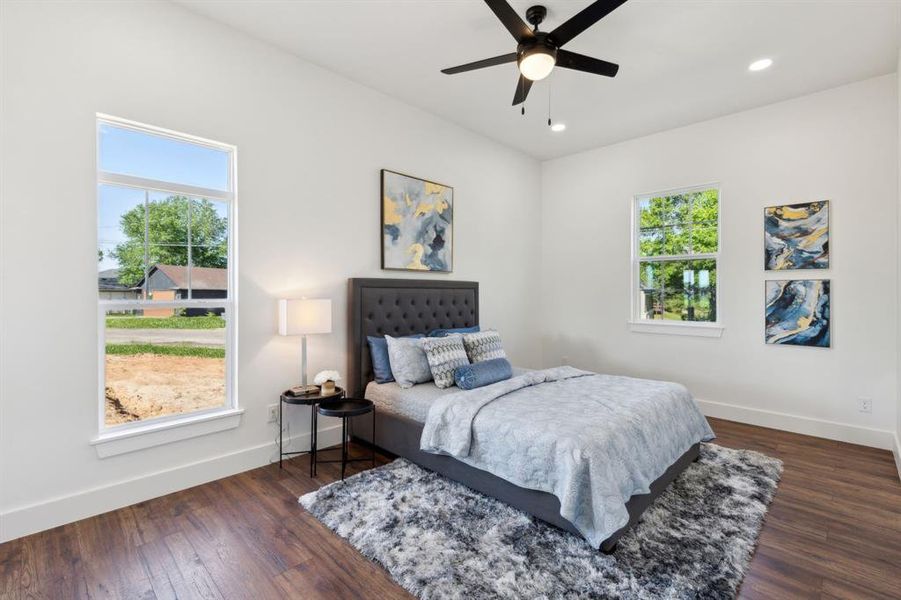 The primary bedroom has great light and a ceiling fan The primary bedroom has great light and a ceiling fan