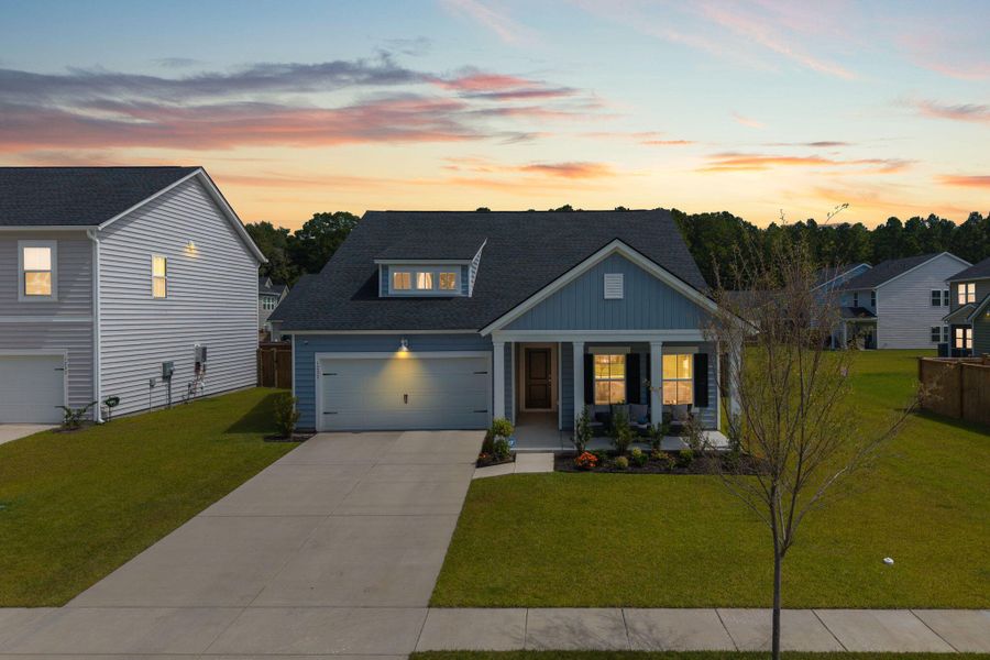 Front exterior of a new home in Sweetgrass at Summers Corner: Arbor Collection, Summerville, SC, highlighting curb appeal (Image 22). Front exterior of a new home in Sweetgrass at Summers Corner: Arbor Collection, Summerville, SC, highlighting curb appeal (Image 22).