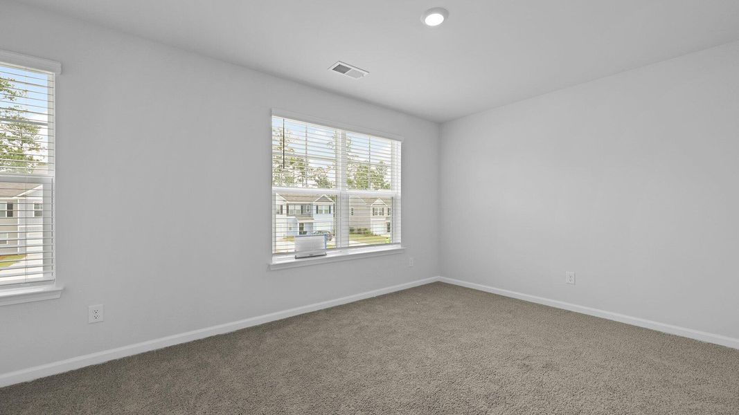 Spacious, unfurnished interior of a new home in Pine Hills Townhomes at Cane Bay, Summerville (Image 29). Spacious, unfurnished interior of a new home in Pine Hills Townhomes at Cane Bay, Summerville (Image 29).