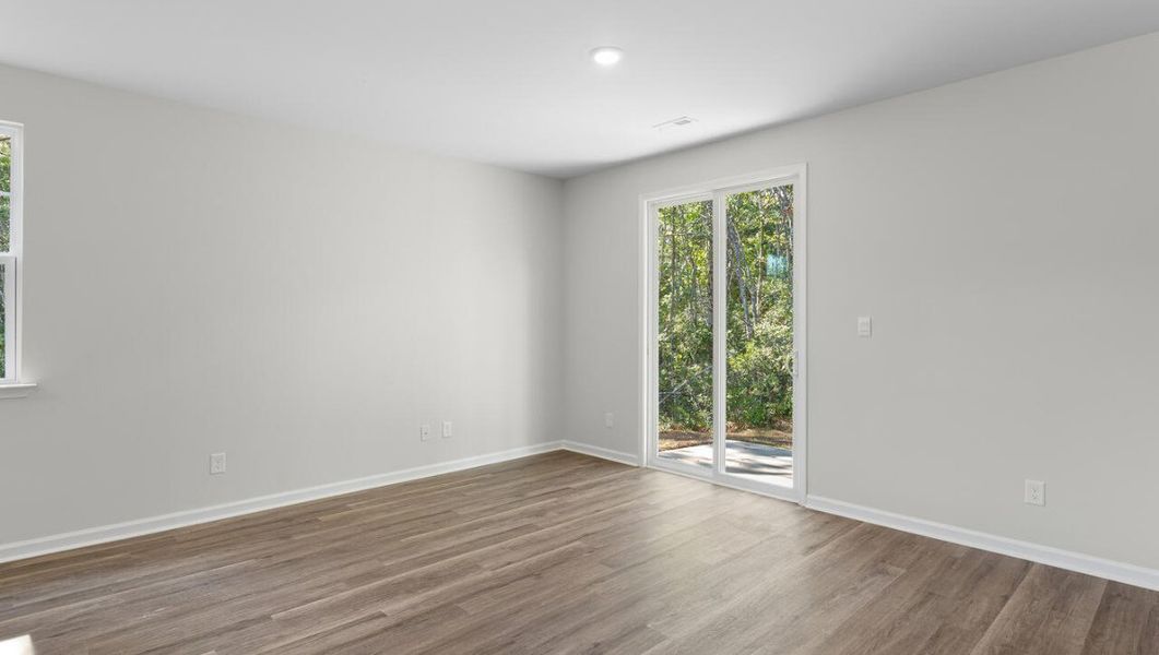Representative unfurnished interior of a home built from the WOODSTOCK by D.R. Horton in Surfside Landing, Hubert (Image 16).
