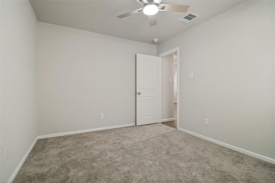 Neutral wall color with white trim, complementing the grey carpet Neutral wall color with white trim, complementing the grey carpet