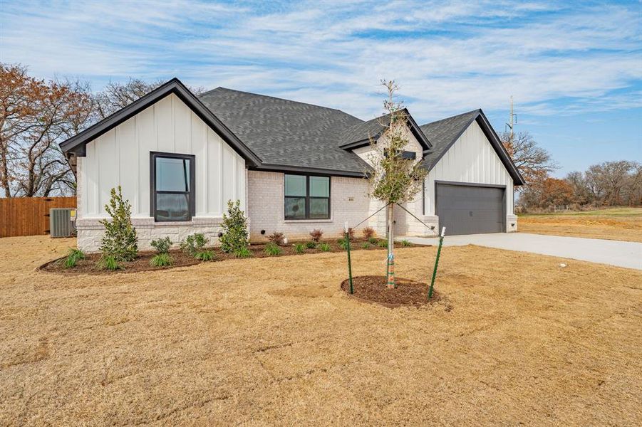 Front exterior of a new home in , Tolar, TX, highlighting curb appeal (Image 21).