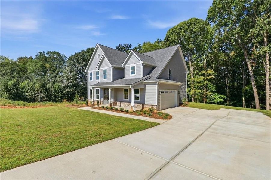 Front exterior of a new home in , Statham, GA, highlighting curb appeal (Image 29).