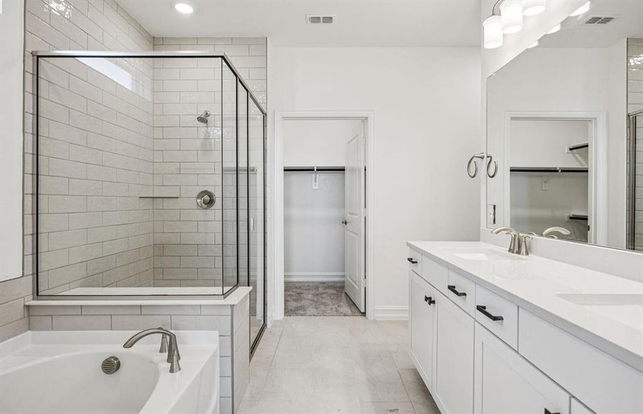 Luxurious owner's bath complete with double sinks and a generous shower *Real home pictured Luxurious owner's bath complete with double sinks and a generous shower *Real home pictured