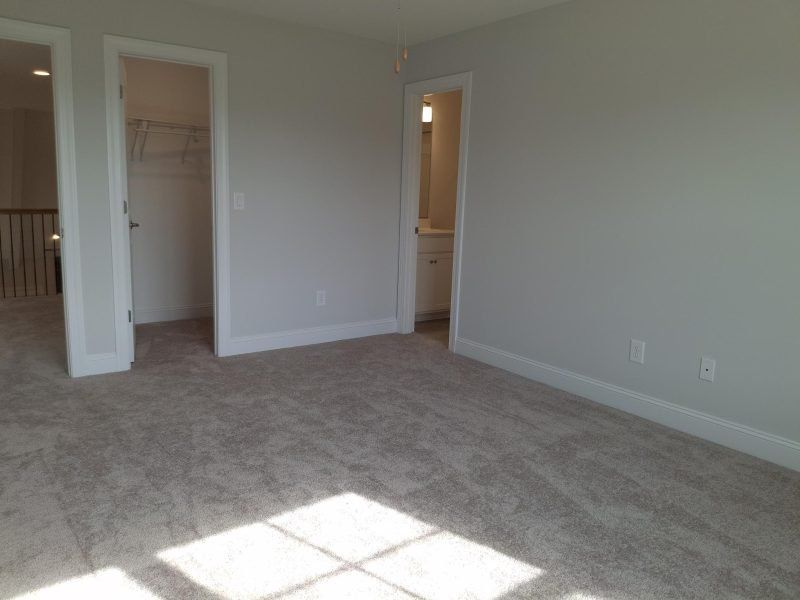Spacious, unfurnished interior of a new home in Weybridge, Burlington (Image 52).