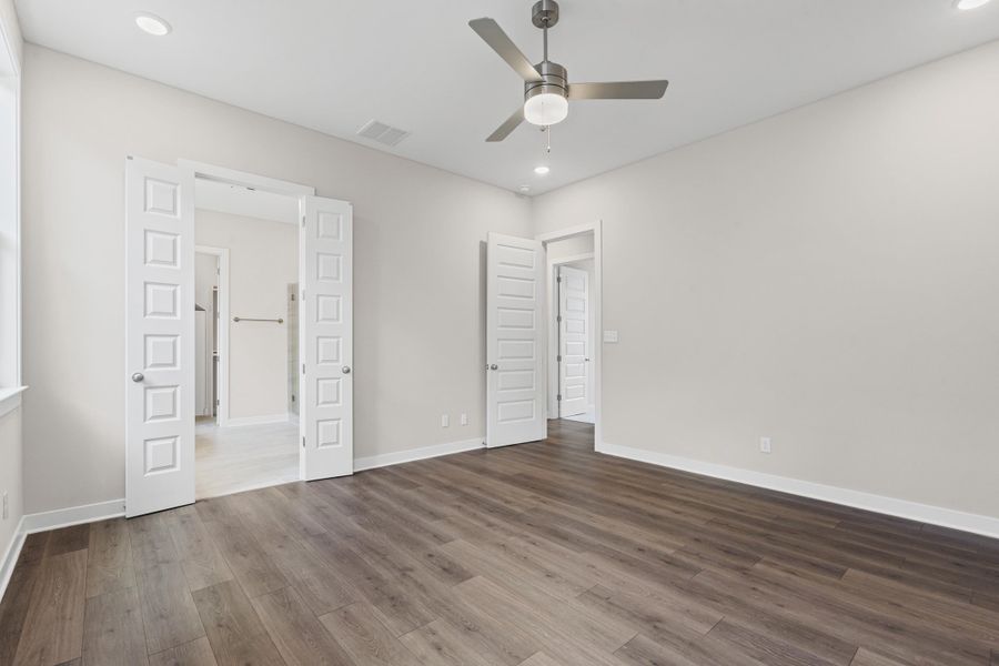 Unfurnished bedroom featuring recessed lighting, wood finished floors, and ceiling fan