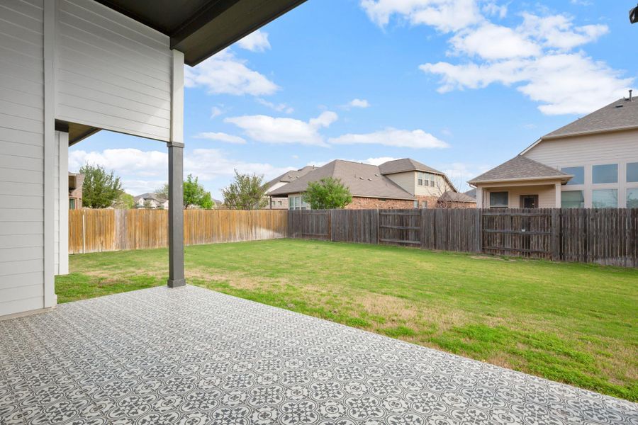 Enjoy a Texas-sized covered patio, finished with upgraded tile and an extra high ceiling, which creates an ideal setting for gatherings. Enjoy a Texas-sized covered patio, finished with upgraded tile and an extra high ceiling, which creates an ideal setting for gatherings.