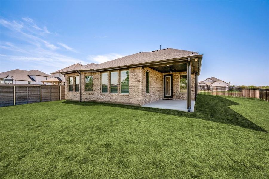 Exterior details and patio area of a home in , Little Elm (Image 24). Exterior details and patio area of a home in , Little Elm (Image 24).